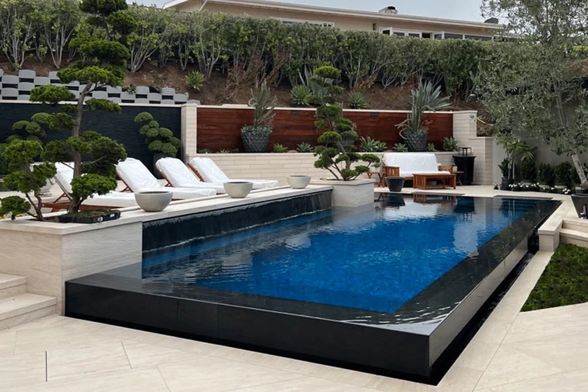 Outdoor pool area featuring custom vertical garden and modern hardscaping.