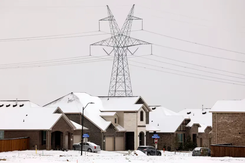 Snow-covered DFW neighborhood with rooftops under winter storm conditions, showing the need for seasonal roof and home maintenance.