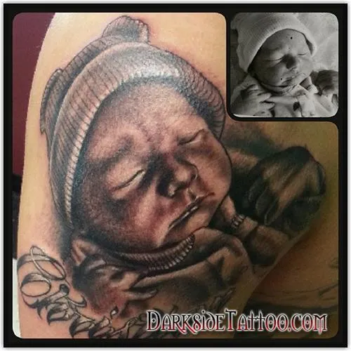 Black and Gray Baby Portrait Tattoo