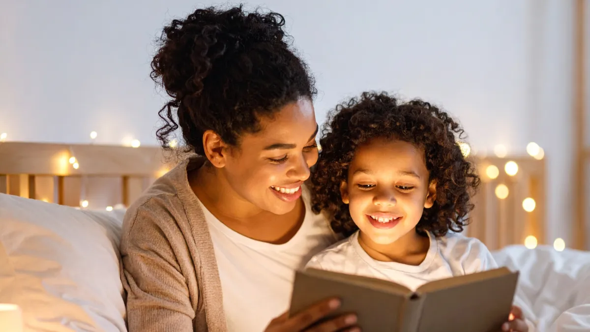 Mom reading to her child at bedtime, symbolizing protecting your family’s future with a living trust and avoiding probate delays.