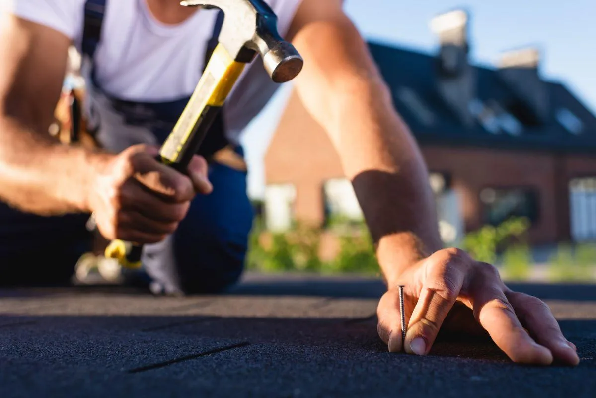 roofing specialist doing roof repair