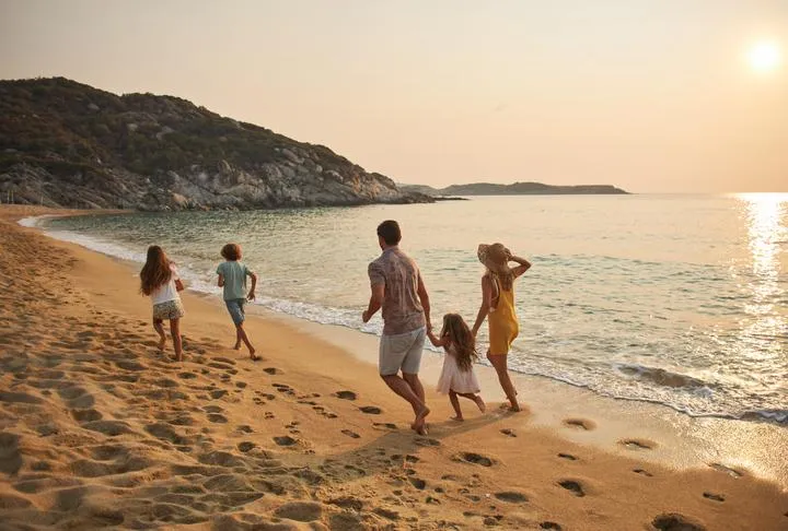 family enjoying themselves on the beach