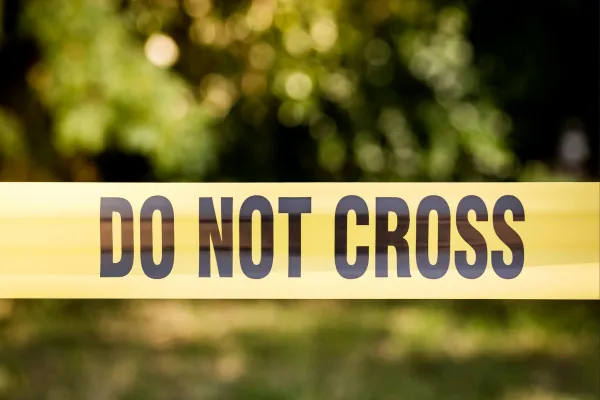 A "DO NOT CROSS" Police tape across image, representing a firly set boundary