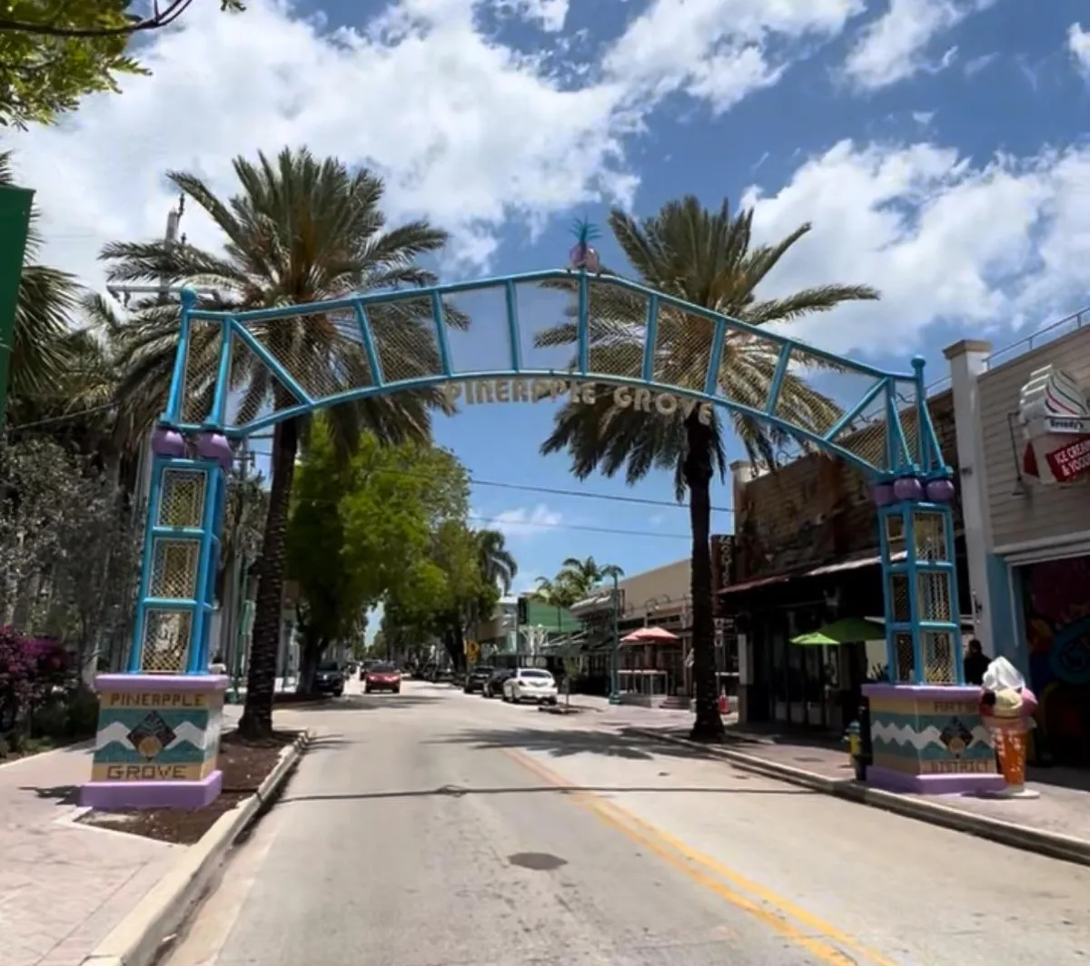 Colorful street scene in Pineapple Grove, Delray Beach ā a vibrant neighborhood featured in a homebuying guide by Frankelley Nunez, RealtorĀ®, exploring top things to know before buying homes for sale in Delray Beach.