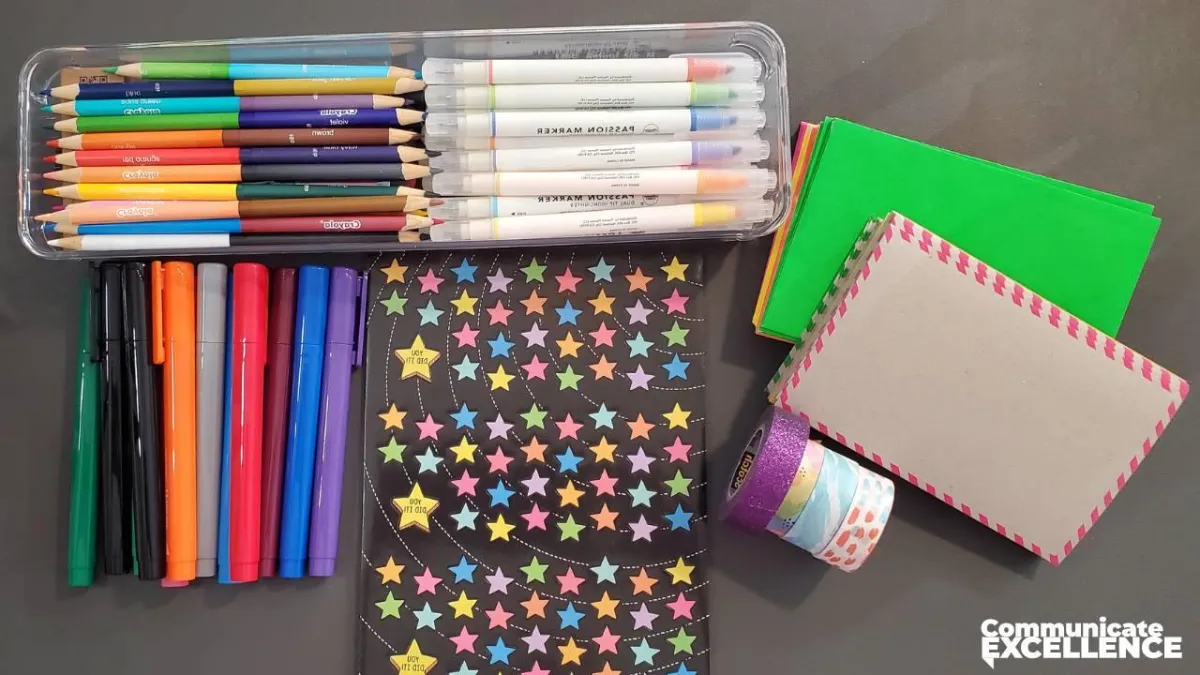 Stationary, pens, and stickers to write a handwritten note