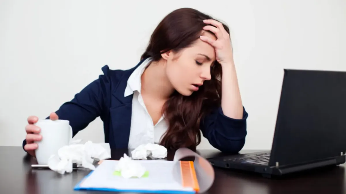 frustrated woman at desk