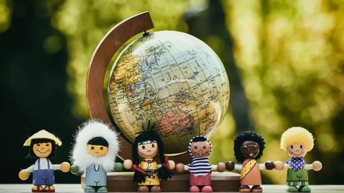 globe with many different nationalities of people