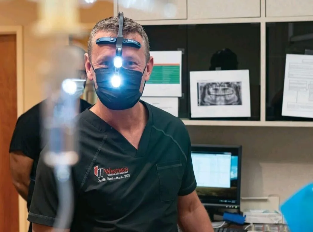 Dr. Heath Hendrickson performing IV Sedation during removal