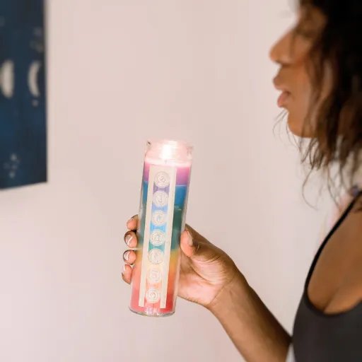 woman holding a lit candle