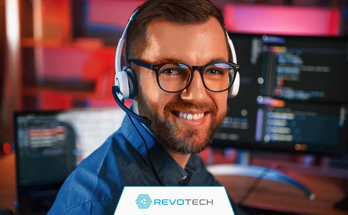 Remote IT support specialist smiling during a help desk call.