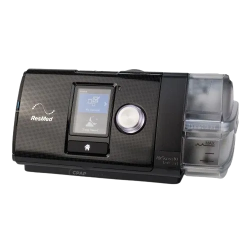Respiratory therapist adjusting a CPAP machine on a patient for a comfortable night's sleep.