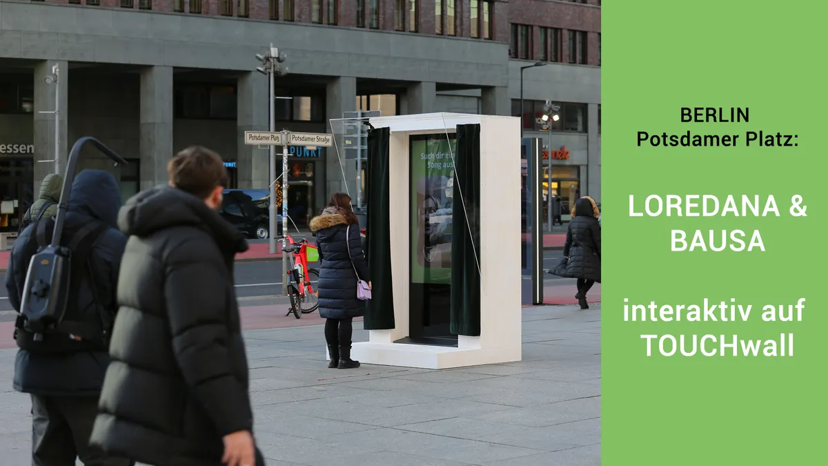„Loredana und Bausa auf TOUCHwall – interaktive Kampagne für SOS-Kinderdörfer weltweit, präsentiert auf digitalen Werbedisplays im öffentlichen Raum.“