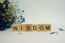 scrable tiles spelling wisdom 