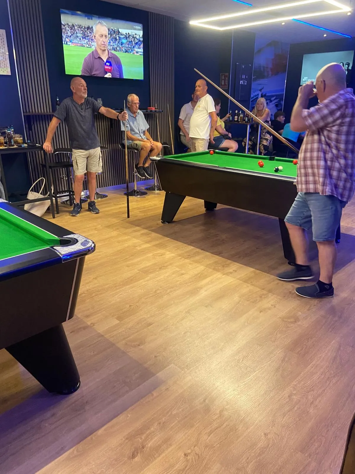 black pool table with green cloth