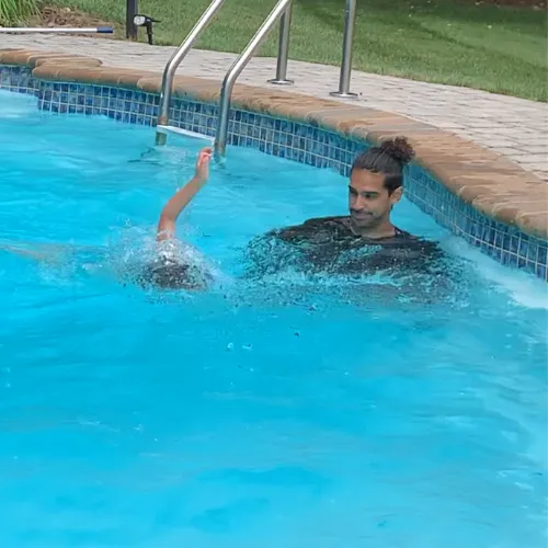 Addison Swimming the full length of pool