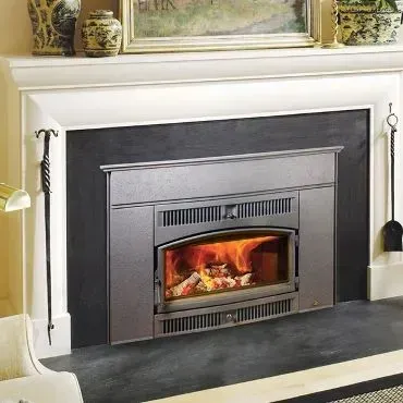 How do I clean my fireplace or wood stove glass door?