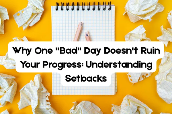 A notepad with a broken pencil on top, surrounded by crumpled pieces of graph paper on a bright yellow background. The text overlay reads, “Why One ‘Bad’ Day Doesn’t Ruin Your Progress: Understanding Setbacks,” highlighting the message that setbacks are a normal part of the weight loss journey.