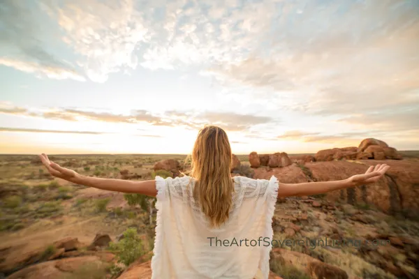 A Woman Overlooking the Landscape with Arms Outstretched