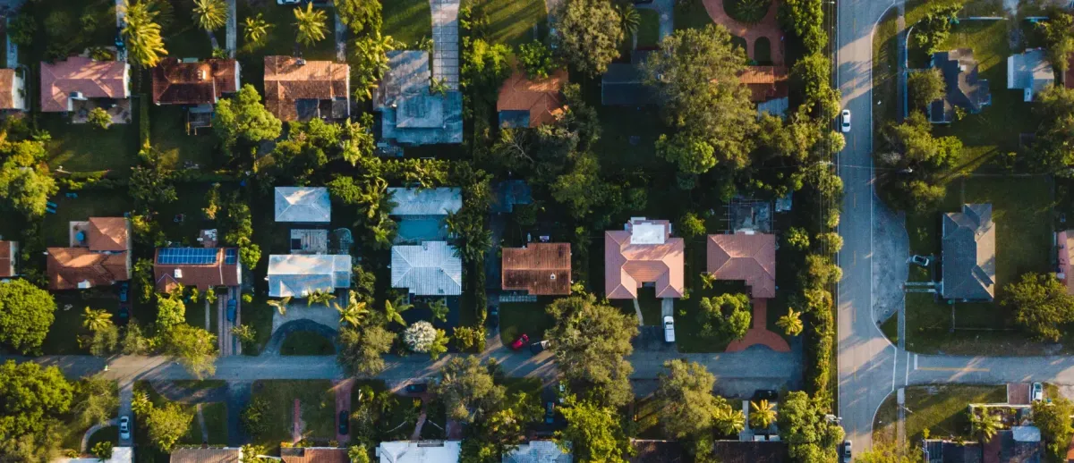 Aerial view of Richardson, Texas neighborhood with older family homes — symbolizing families selling a parent’s home as-is for senior care transitions.