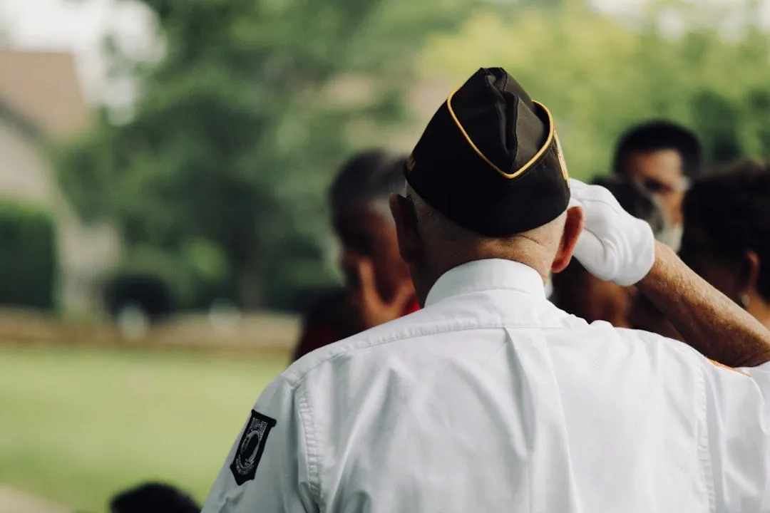Elderly veteran couple reviewing VA pension paperwork together at home