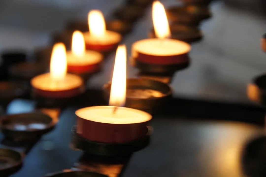 Candles lit in memory, symbolizing the passing of a loved one and the start of the Texas probate process.