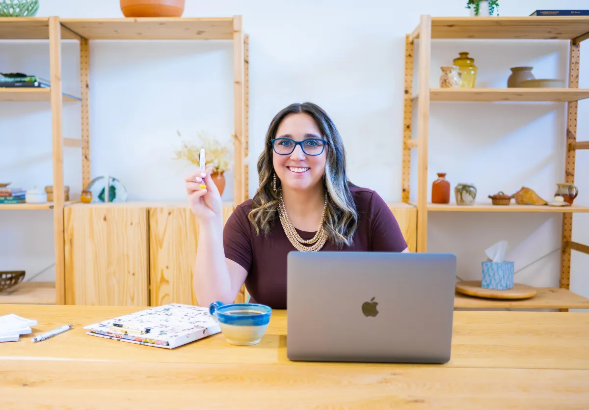 Person analyzing accounting software options at desks on analyzing accounting software options at desk