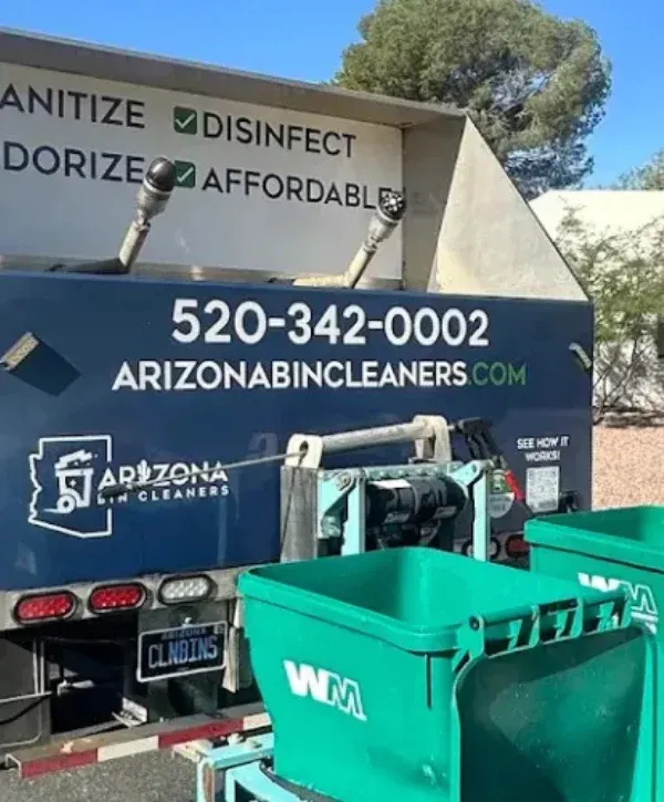 Rear view of Arizona Bin Cleaners truck with phone number and services listed