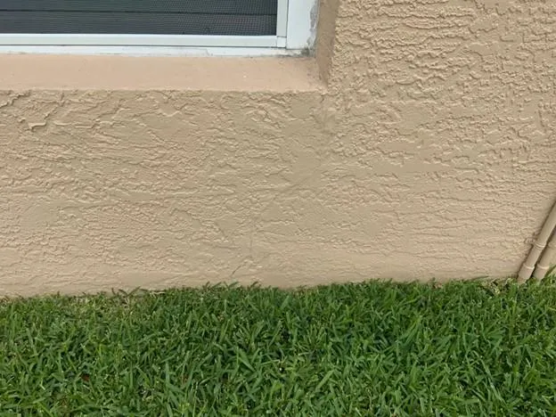 Stucco cracking under a window