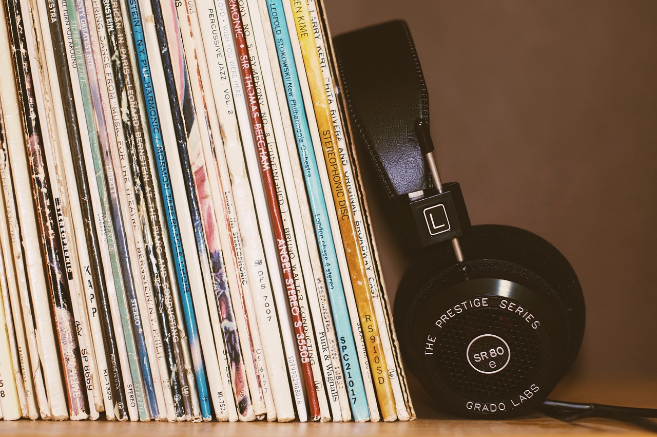 headphones leaning against records