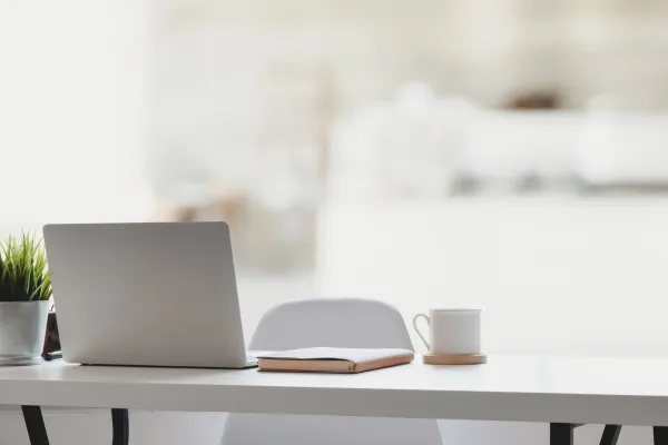Clean desk with computer and drink