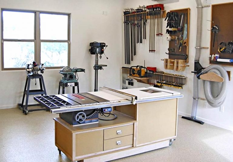 Small woodworking shop setup in a compact space with essential tools and workbench