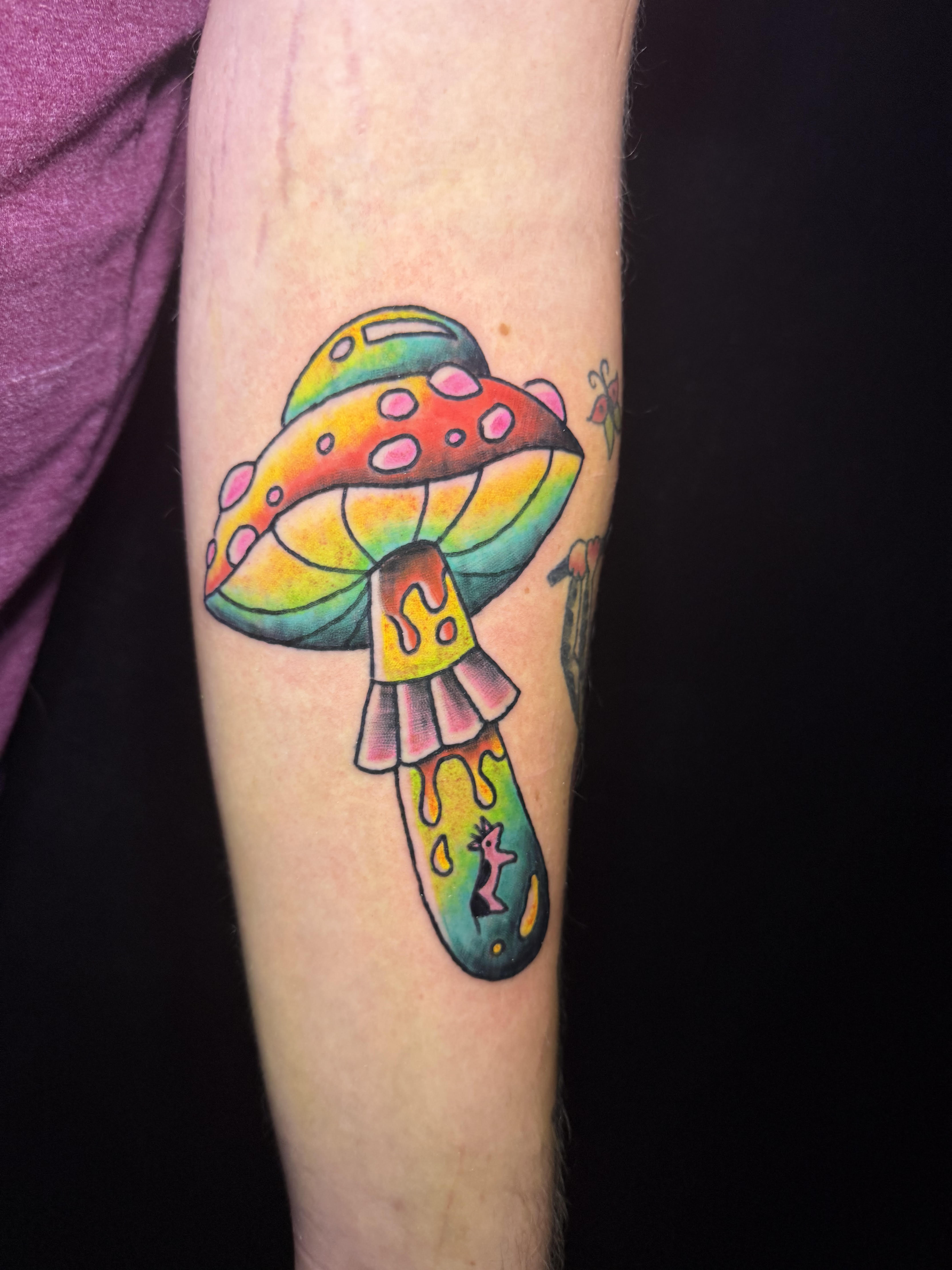 Photo of client's tattoo of a color American Traditional Mushroom UFO by Aiden at Red Arbor Tattoo