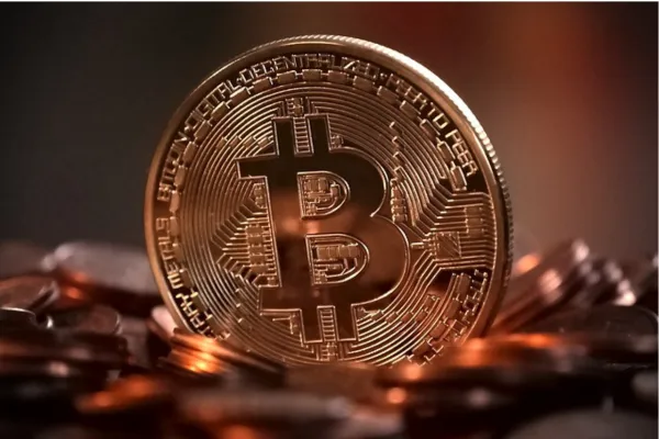 Close-up image of a shiny Bitcoin coin, symbolizing digital currency and blockchain technology.