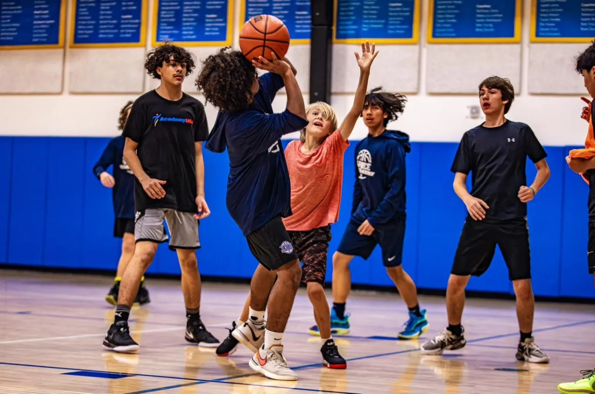 Boys playing a basketball scrimmage