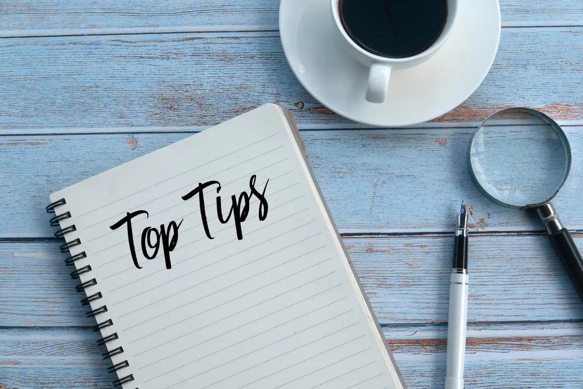 Image of a laptop with a notepad, pen, and coffee cup, representing business tips and the role of Saunders Staffing Agency in supporting organizations.