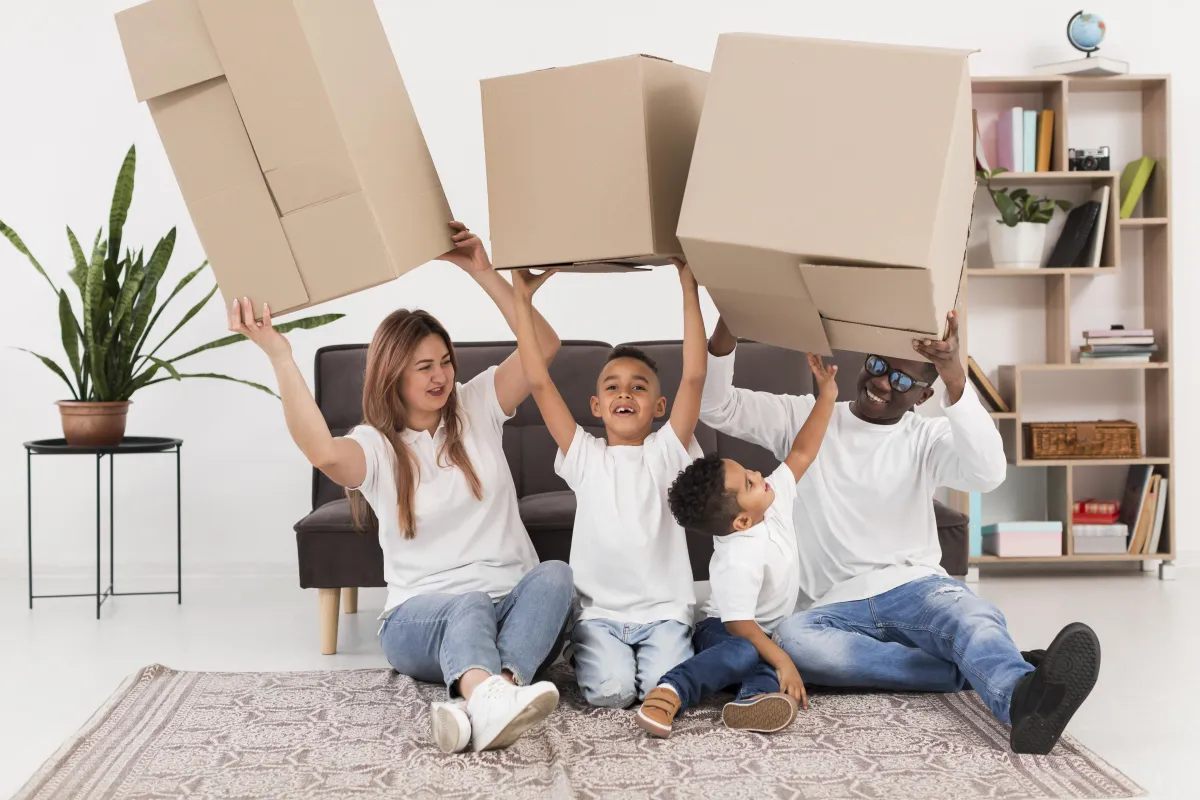 Family relaxing in a temporary Dallas apartment with packed boxes nearby