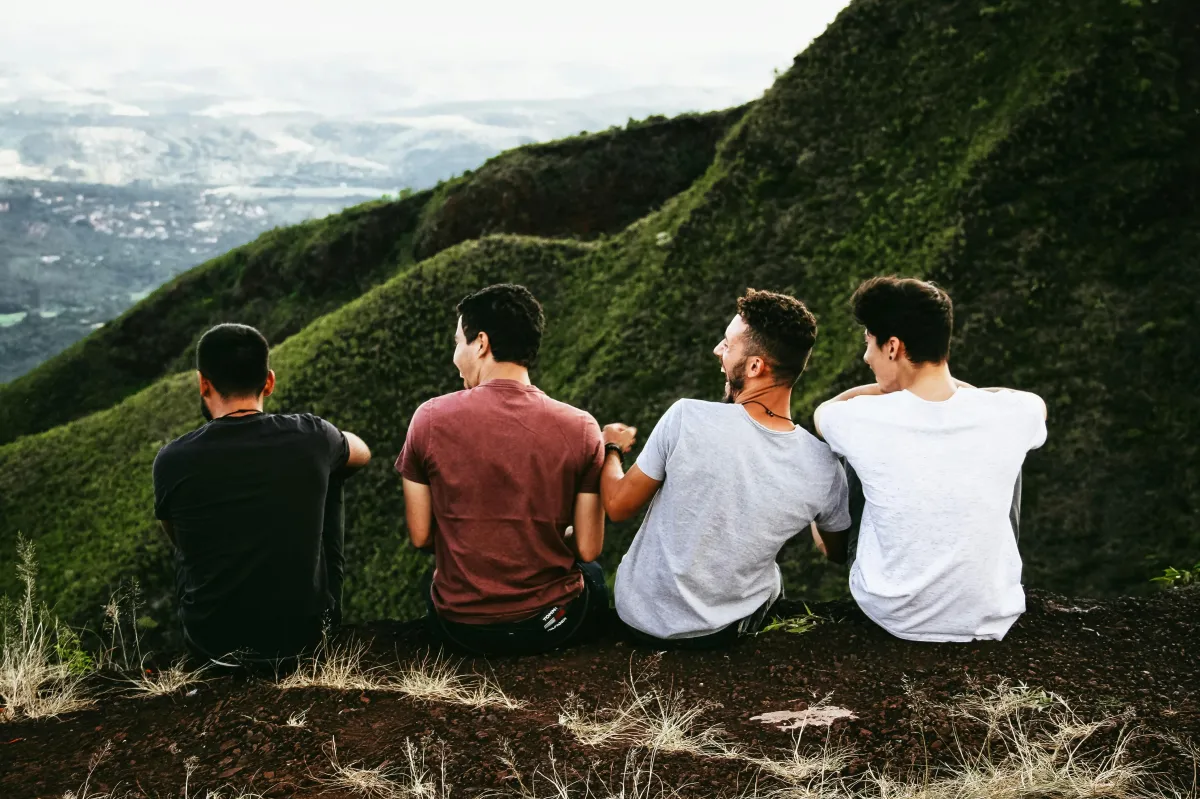 Photo of 4 men on mountain