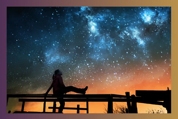 woman looking at the night sky