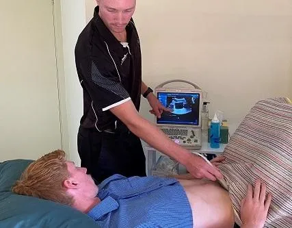 Mens health physio with client