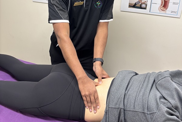 Physio treating clients back