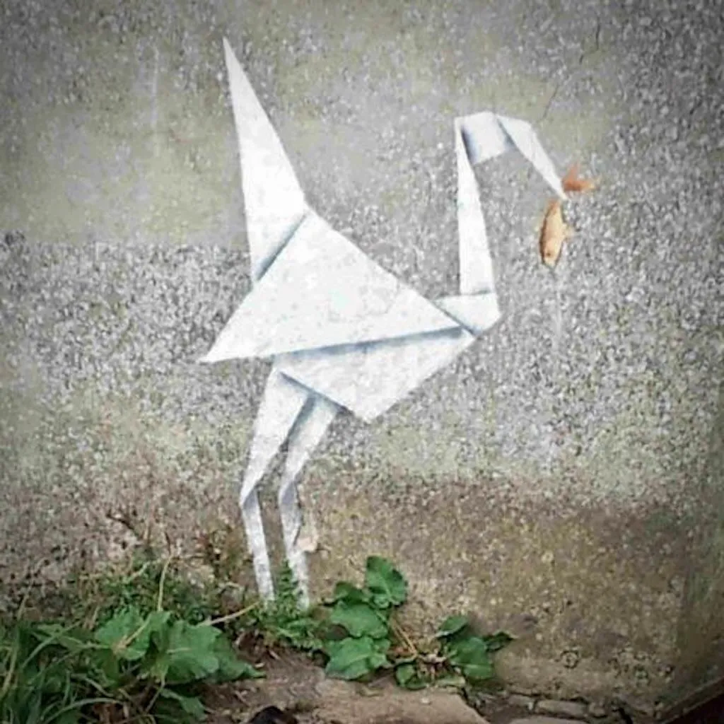 Banksy-style crane street art in Lyme Regis