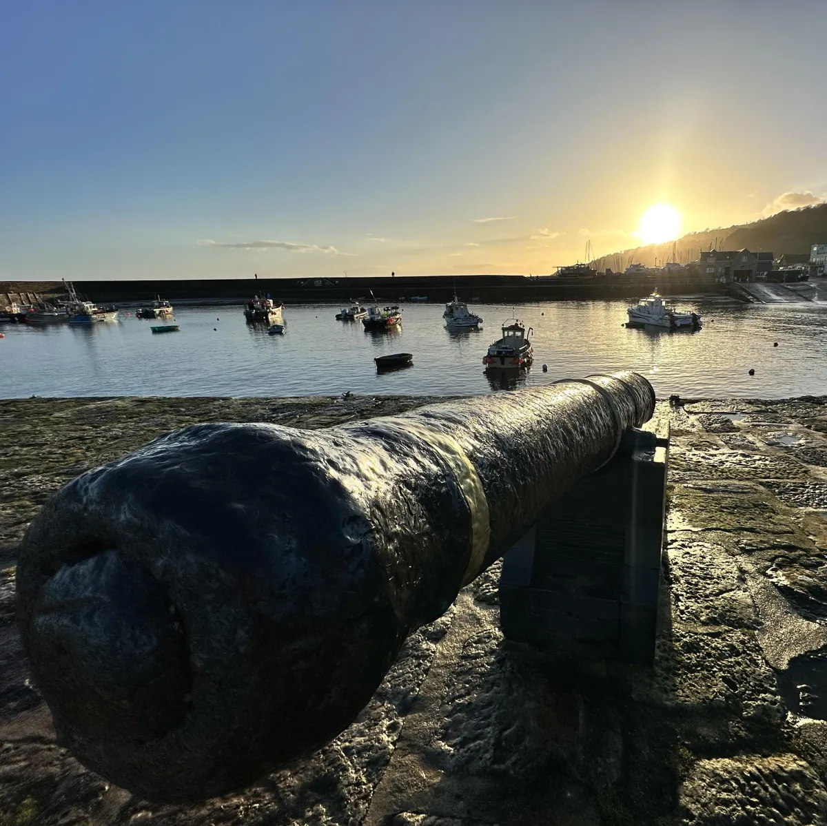 Canons ion Lyme Regis Cobb summer sunset