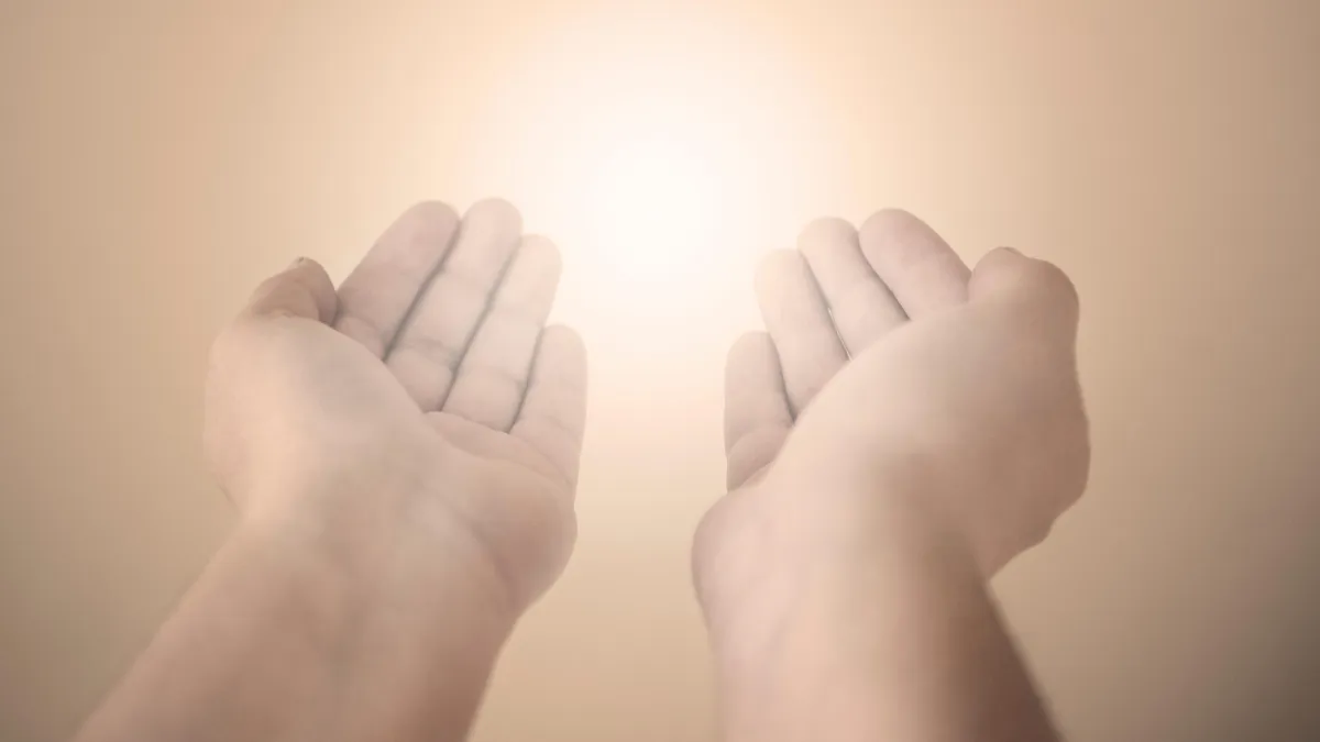 Healing hands with glowing light – Represents the Holy Spirit working through miracles and healing.