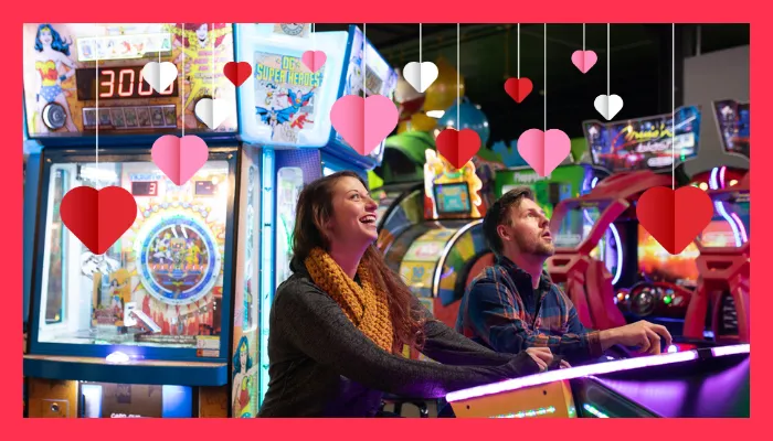 A couple playing arcade games in Action City