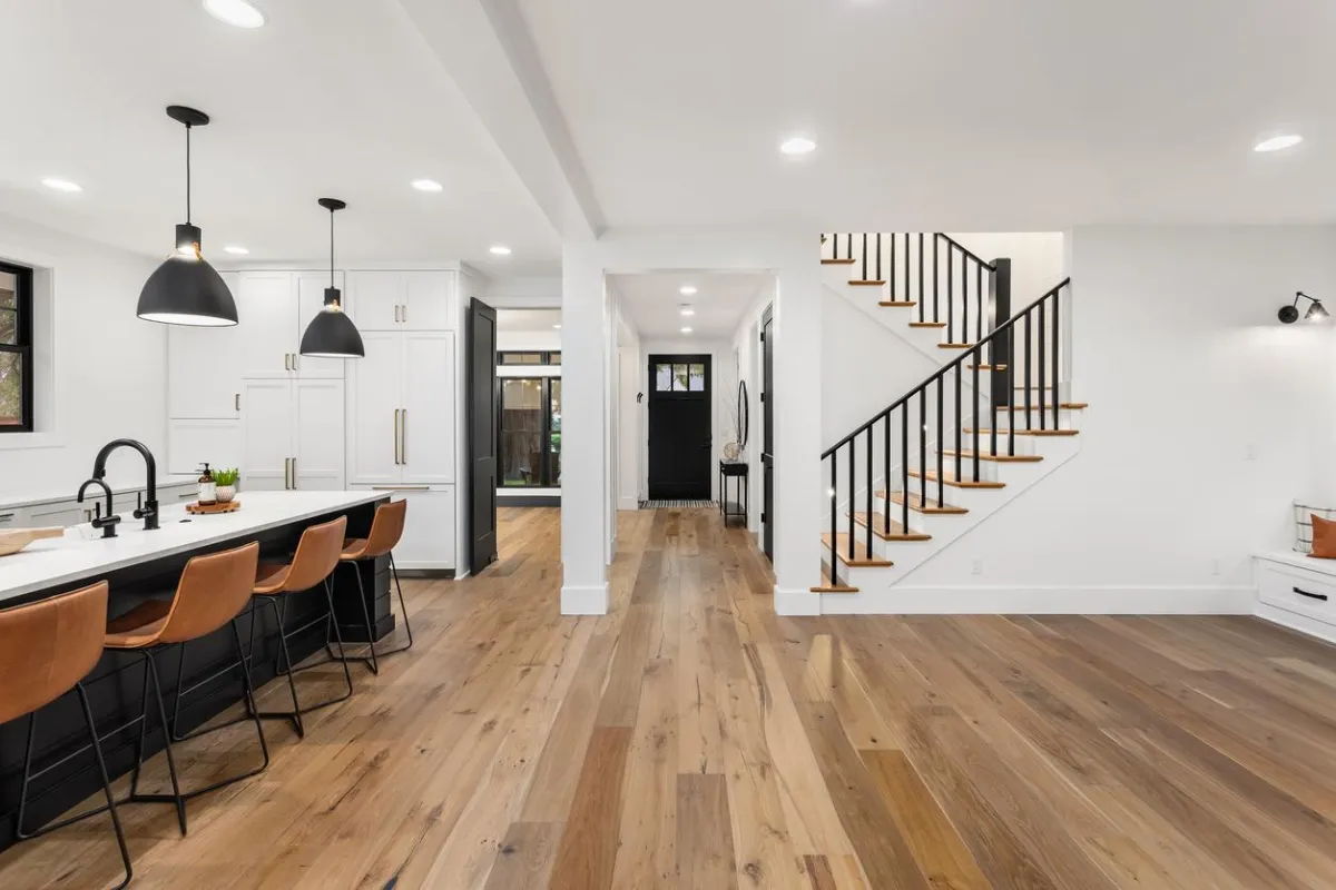 Hardwood flooring in a modern living room with natural light.