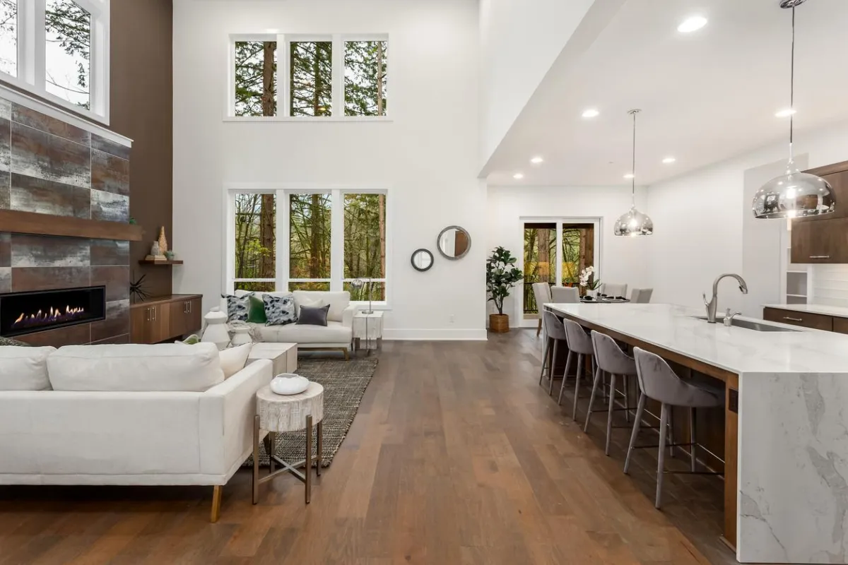 Glossy hardwood planks reflecting sunlight from large windows.