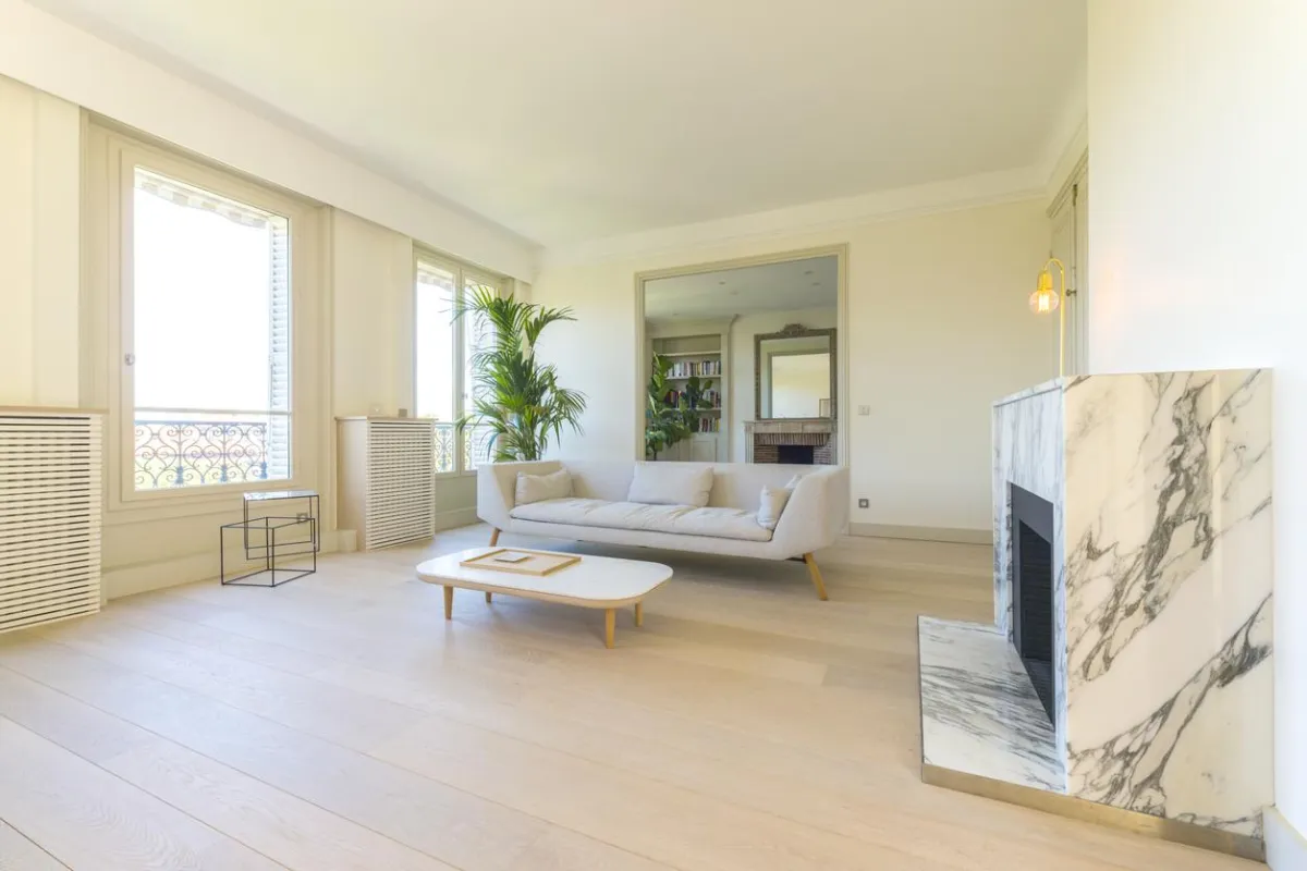 Dark laminate flooring paired with white cabinetry.