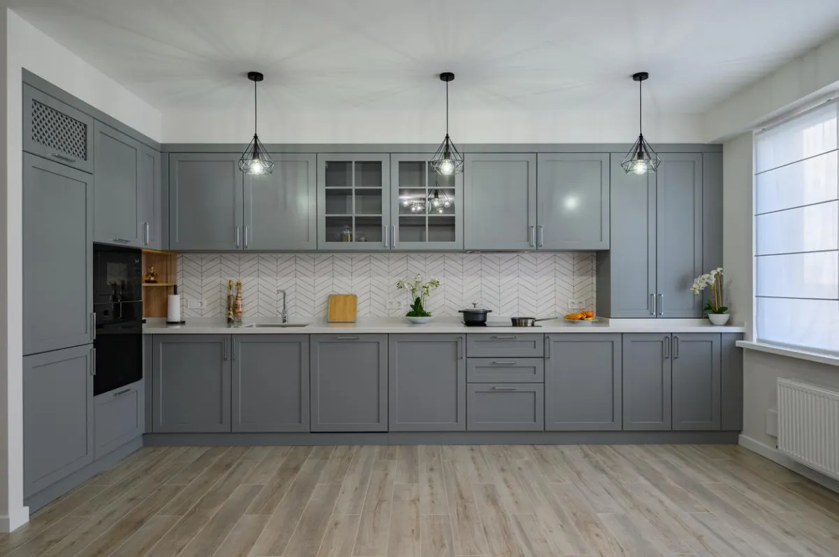 Light oak laminate flooring with modern furniture.