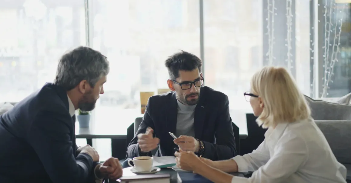Three people discussing
