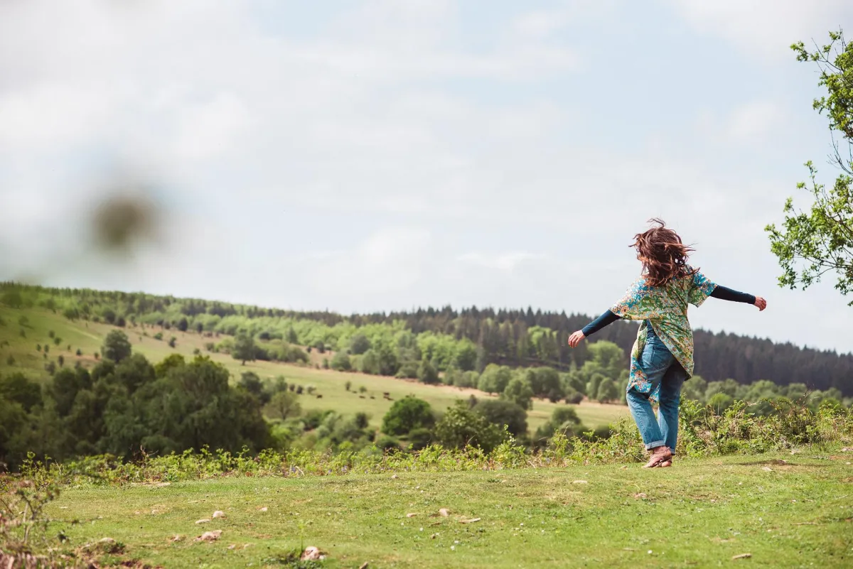 woman moving in field